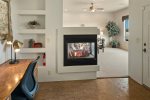 A workspace and cozy gas fireplace for winter warmth